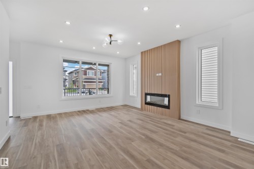324 Roberts Wynd, Leduc, AB - Indoor Photo Showing Living Room With Fireplace