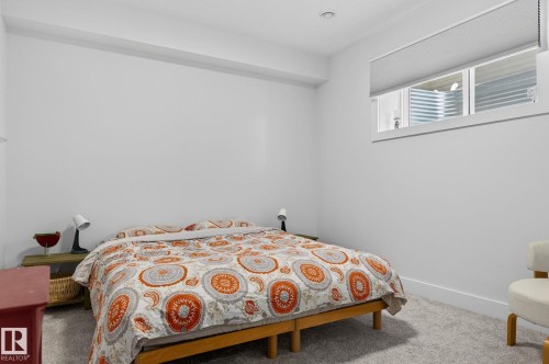 Recessed ceiling lighting, window with horizontal blinds, light-toned carpeting, white wall finishes, and white trim - 45 Evermore Crescent, St. Albert, AB - Indoor Photo Showing Bedroom