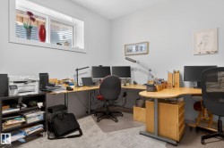 Recessed window with white trim, light gray wall paint, and light gray carpeting - 