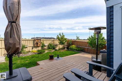 Expansive backyard with a multi-level wood deck, manicured lawn, and perimeter fencing - 45 Evermore Crescent, St. Albert, AB - Outdoor With Deck Patio Veranda