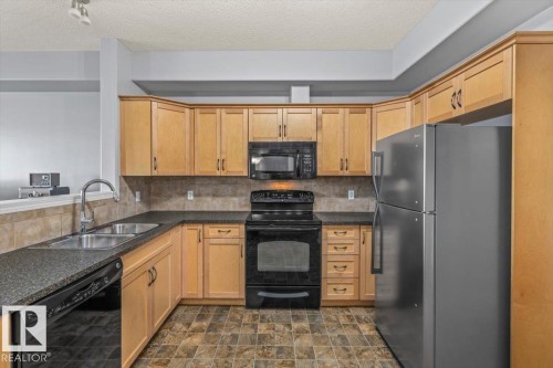 #342 45 Inglewood Dr, St. Albert, AB - Indoor Photo Showing Kitchen With Double Sink