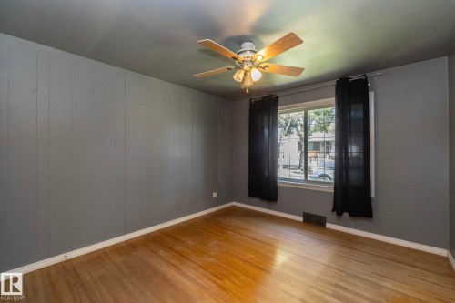 Hardwood flooring throughout - 12322 94 Street Nw, Edmonton, AB - Indoor Photo Showing Other Room