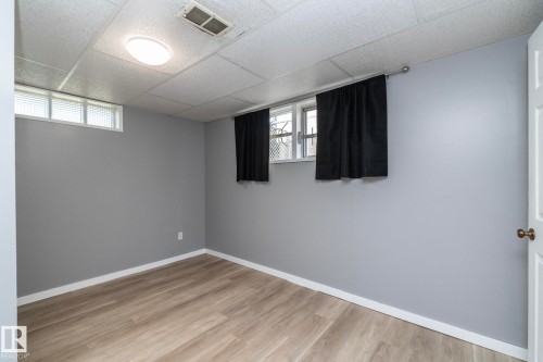 Recessed ceiling with integrated lighting - 12322 94 Street Nw, Edmonton, AB - Indoor Photo Showing Other Room