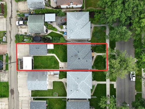 Spacious lot featuring a main residence, detached garage, and expansive lawn areas - 12322 94 Street Nw, Edmonton, AB - Outdoor