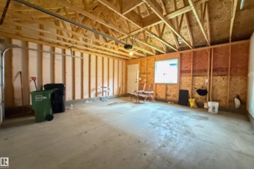 Exposed wood framing and concrete flooring - 7109 Chivers Close Sw, Edmonton, AB - Indoor