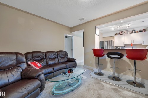 3910 49 Avenue, Beaumont, AB - Indoor Photo Showing Living Room