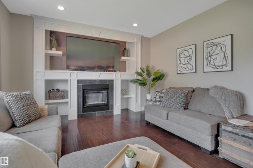 3910 49 Avenue, Beaumont, AB - Indoor Photo Showing Living Room With Fireplace