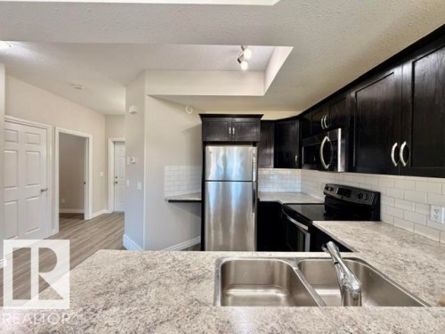 #8 4702 57 Av, Wetaskiwin, AB - Indoor Photo Showing Kitchen With Double Sink With Upgraded Kitchen