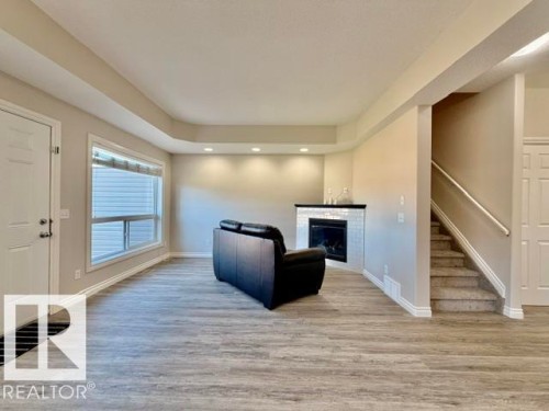 #8 4702 57 Av, Wetaskiwin, AB - Indoor Photo Showing Other Room With Fireplace