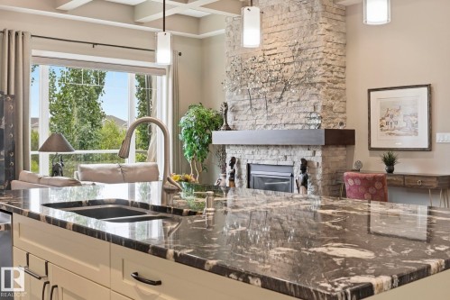 657 178A Street Sw, Edmonton, AB - Indoor Photo Showing Kitchen With Fireplace With Double Sink