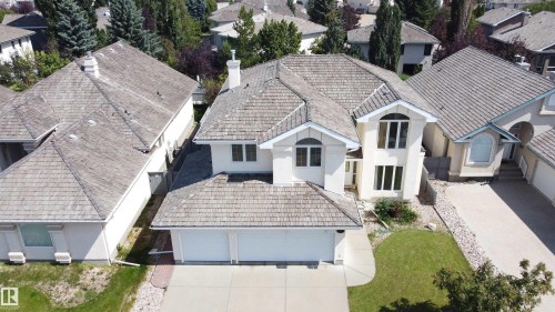 Light-toned stucco exterior with a multi-level roofline - 237 Darlington Crescent Nw, Edmonton, AB - Outdoor