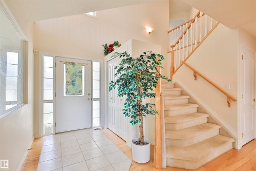 Entryway featuring a white paneled door with sidelights, transom window, and tile flooring - 237 Darlington Crescent Nw, Edmonton, AB - Indoor Photo Showing Other Room