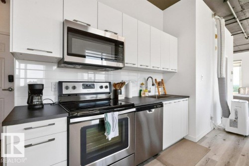 #1609 10024 Jasper Av Nw, Edmonton, AB - Indoor Photo Showing Kitchen With Stainless Steel Kitchen