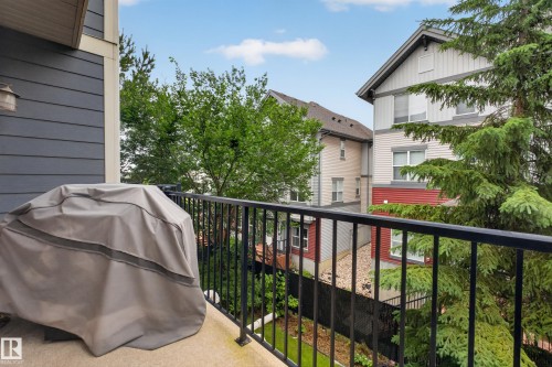 Private balcony featuring a black metal railing and exterior wall siding - #53 603 Watt Bv Sw, Edmonton, AB - Outdoor With Balcony With Exterior