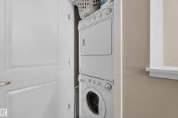 Stackable laundry appliances integrated within a dedicated alcove - 