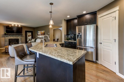 854 Chahley Way Nw, Edmonton, AB - Indoor Photo Showing Kitchen With Fireplace With Stainless Steel Kitchen With Double Sink