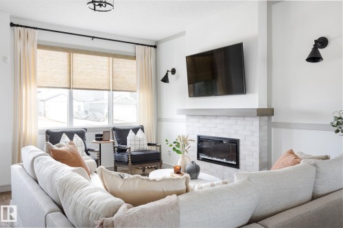 21204 25 Avenue Nw, Edmonton, AB - Indoor Photo Showing Living Room With Fireplace