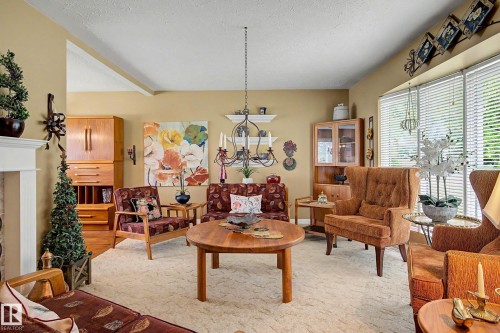 10715 50 Street Nw, Edmonton, AB - Indoor Photo Showing Living Room With Fireplace