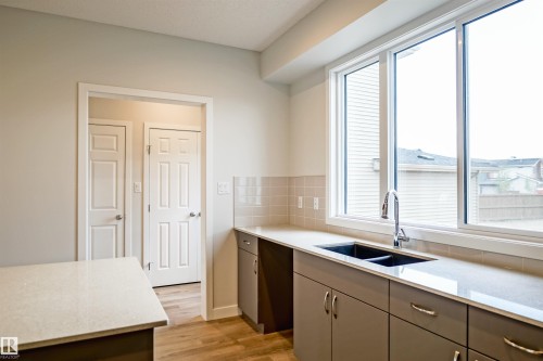 21148 25 Avenue Nw, Edmonton, AB - Indoor Photo Showing Kitchen With Double Sink