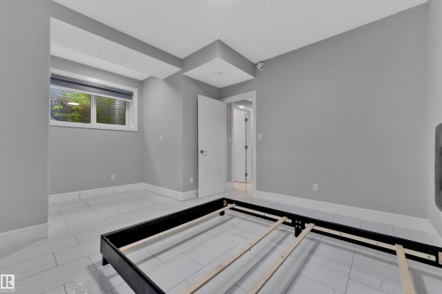 Room featuring neutral gray walls and white trim - 9329 Connors Road Nw, Edmonton, AB - Indoor Photo Showing Other Room