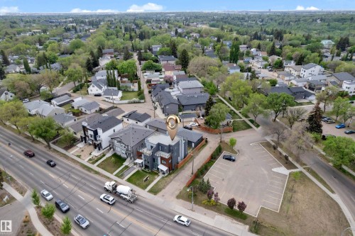 Aerial perspective showcasing a multi-story property with a dark-toned exterior - 9329 Connors Road Nw, Edmonton, AB - Outdoor With View