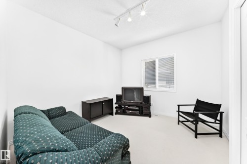 Room with white walls, track lighting, a single window, and light-toned carpeting - 209 Carmichael Close Nw, Edmonton, AB - Indoor