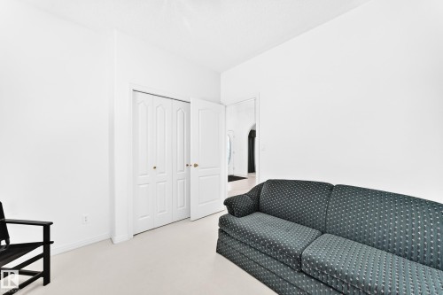 White painted walls, white trim, and white bi-fold closet doors - 209 Carmichael Close Nw, Edmonton, AB - Indoor