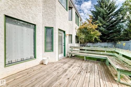 Expansive wood-plank deck with built-in seating - 209 Carmichael Close Nw, Edmonton, AB - Outdoor With Deck Patio Veranda