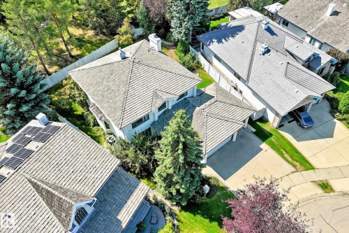 Pitched rooflines, attached two-car garage, concrete driveway, and mature landscaping - 209 Carmichael Close Nw, Edmonton, AB - Outdoor