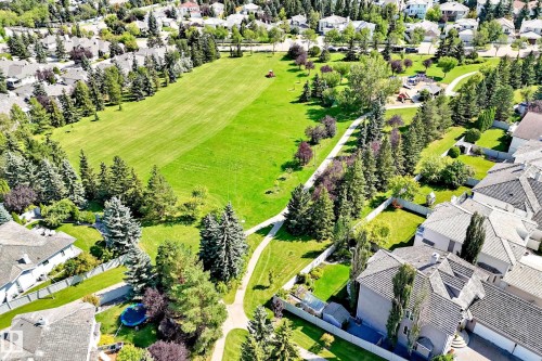 Expansive green spaces and mature trees surround residential properties - 209 Carmichael Close Nw, Edmonton, AB - Outdoor
