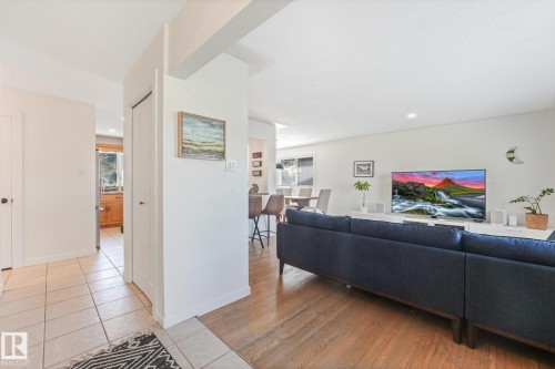 Hardwood-finish flooring, recessed lighting, and tile flooring in the entry - 16613 90 Avenue Nw, Edmonton, AB - Indoor Photo Showing Other Room