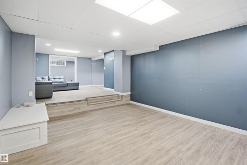 Wood-finish flooring, recessed lighting, drop ceiling, and a built-in storage bench - 3432 Hill View Crescent Nw, Edmonton, AB - Indoor