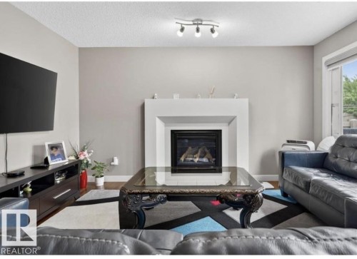 6811 19 Avenue Sw, Edmonton, AB - Indoor Photo Showing Living Room With Fireplace