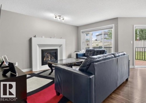 6811 19 Avenue Sw, Edmonton, AB - Indoor Photo Showing Living Room With Fireplace