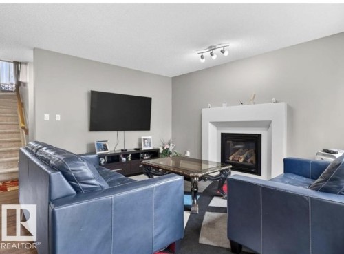 6811 19 Avenue Sw, Edmonton, AB - Indoor Photo Showing Living Room With Fireplace