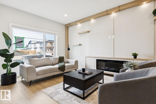 490 Robinson Boulevard, Leduc, AB - Indoor Photo Showing Living Room With Fireplace