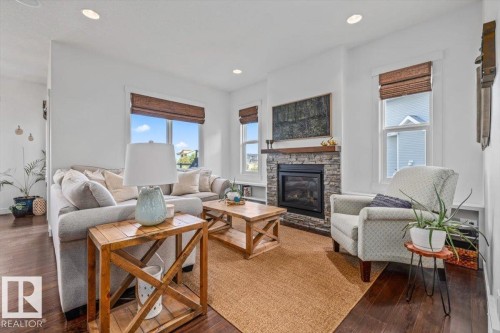58 Ellice Bend, Fort Saskatchewan, AB - Indoor Photo Showing Living Room With Fireplace
