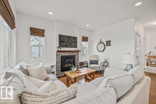 58 Ellice Bend, Fort Saskatchewan, AB - Indoor Photo Showing Living Room With Fireplace