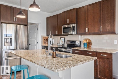 58 Ellice Bend, Fort Saskatchewan, AB - Indoor Photo Showing Kitchen With Double Sink With Upgraded Kitchen