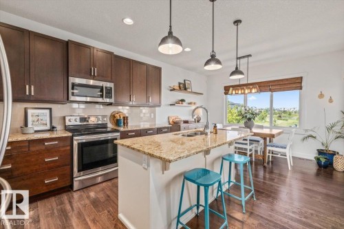 58 Ellice Bend, Fort Saskatchewan, AB - Indoor Photo Showing Kitchen With Double Sink