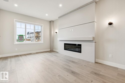 492 Robinson Boulevard, Leduc, AB - Indoor Photo Showing Living Room With Fireplace