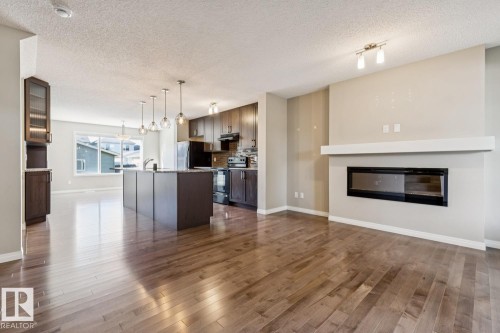 8311 Ellis Crescent Nw, Edmonton, AB - Indoor Photo Showing Living Room With Fireplace