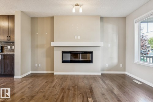 8311 Ellis Crescent Nw, Edmonton, AB - Indoor Photo Showing Living Room With Fireplace