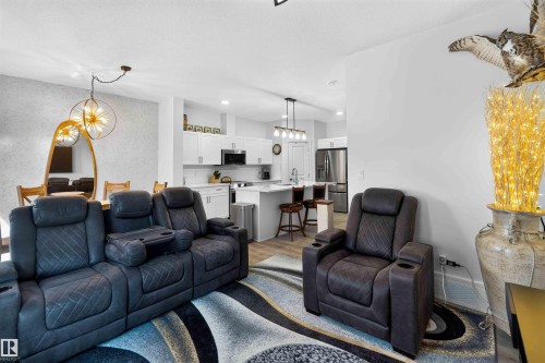 Open-concept living area with wood-finish flooring - 91 Hilton Cove, Spruce Grove, AB - Indoor Photo Showing Living Room
