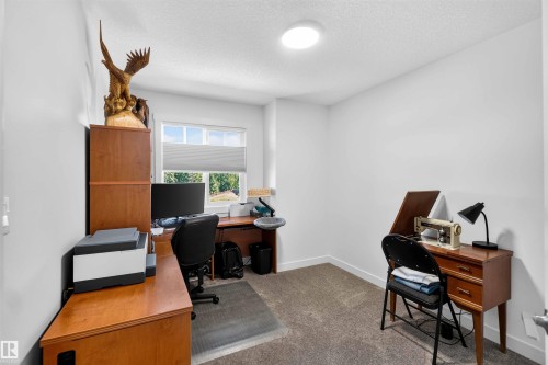 Recessed lighting and a window with blinds provide illumination - 91 Hilton Cove, Spruce Grove, AB - Indoor Photo Showing Office