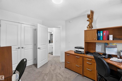 Neutral-toned carpeting, white walls, and bright overhead lighting - 91 Hilton Cove, Spruce Grove, AB - Indoor Photo Showing Office