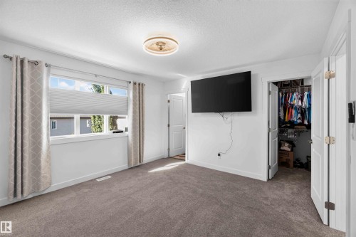 Wall-to-wall carpeting and white walls - 91 Hilton Cove, Spruce Grove, AB - Indoor Photo Showing Other Room