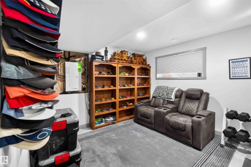 Recessed lighting, wood-finish shelving, and a single window with horizontal blinds - 91 Hilton Cove, Spruce Grove, AB - Indoor
