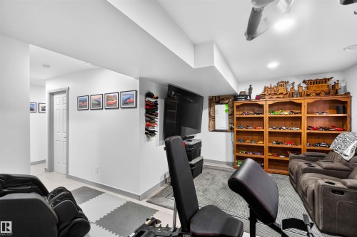 Recessed lighting, wood-finish shelving, paneled interior doors, and a ceiling fan - 91 Hilton Cove, Spruce Grove, AB - Indoor