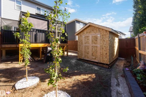 Raised deck with black railings and a privacy screen - 91 Hilton Cove, Spruce Grove, AB - Outdoor With Exterior